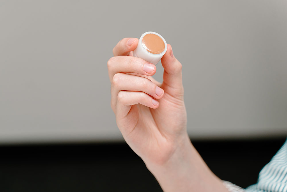 Person holding a sample cup.