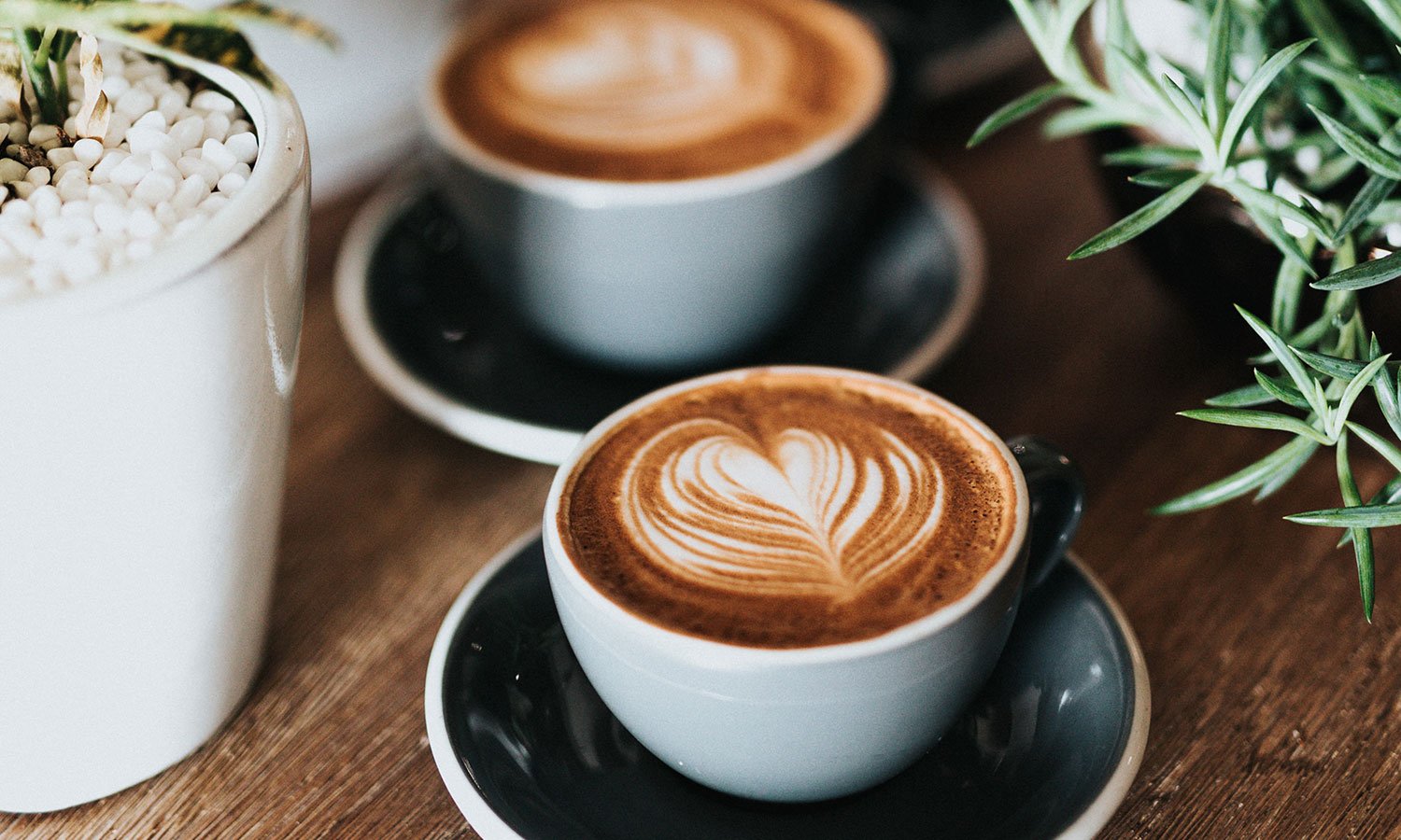 two cups of coffee with latte art